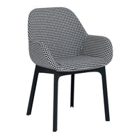 Black and white houndstooth patterned chair with sleek black legs. Modern design for stylish interiors.