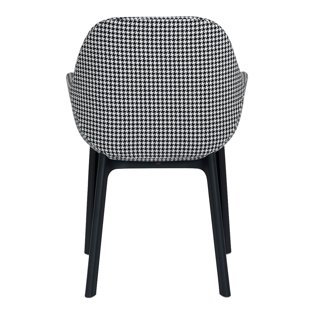 Black and white houndstooth patterned chair with sleek black legs, showcasing modern design and style.