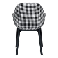 Black and white houndstooth patterned chair with sleek black legs, showcasing modern design and style.