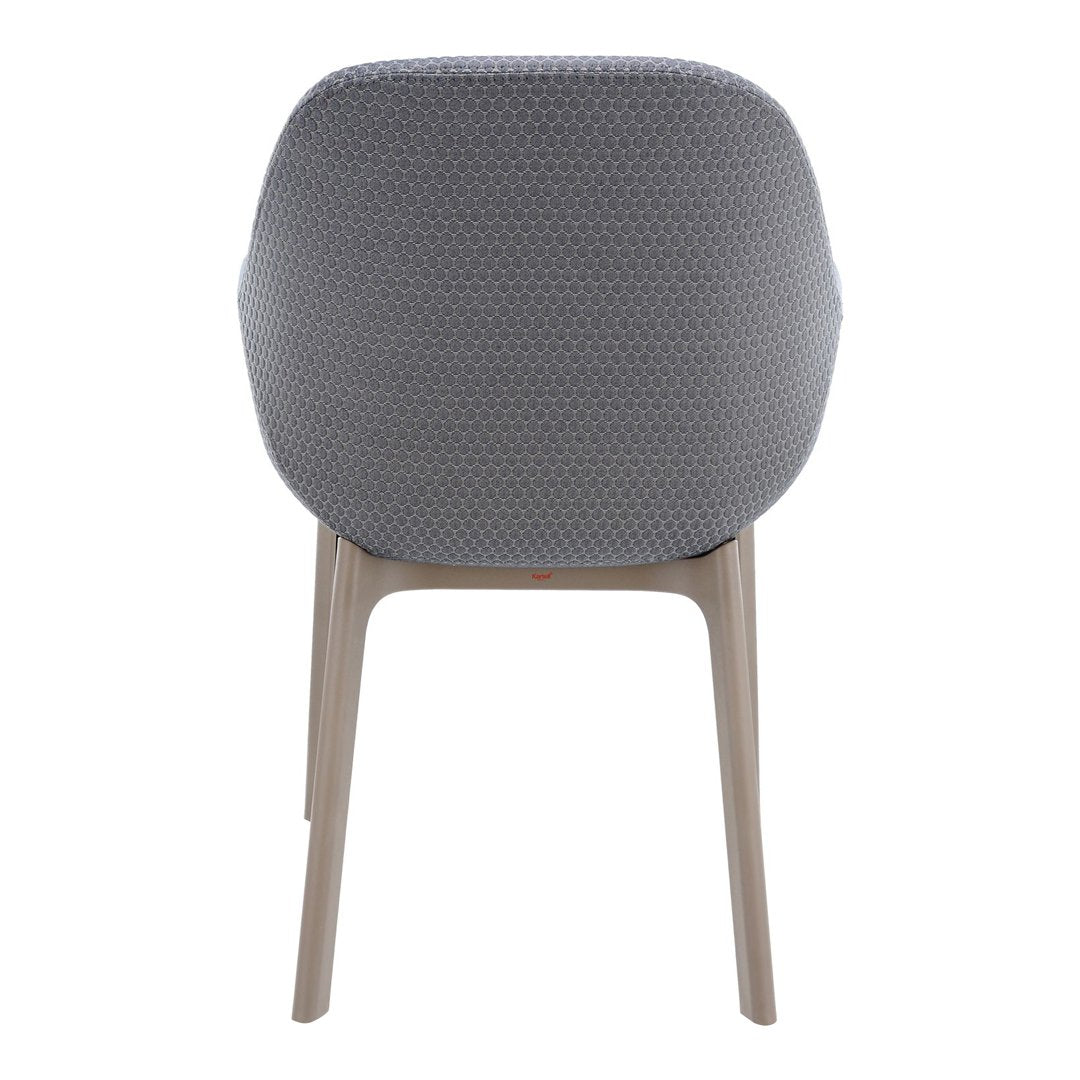 Back view of a grey upholstered chair with a subtle hexagonal pattern and light wooden legs.