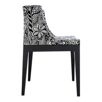 Black and white patterned dining chair featuring floral designs on upholstered fabric with sleek black legs.