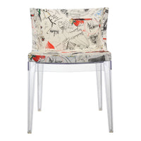 Stylish transparent chair with a colorful, abstract pattern featuring reds, blacks, and sketches on a beige background.