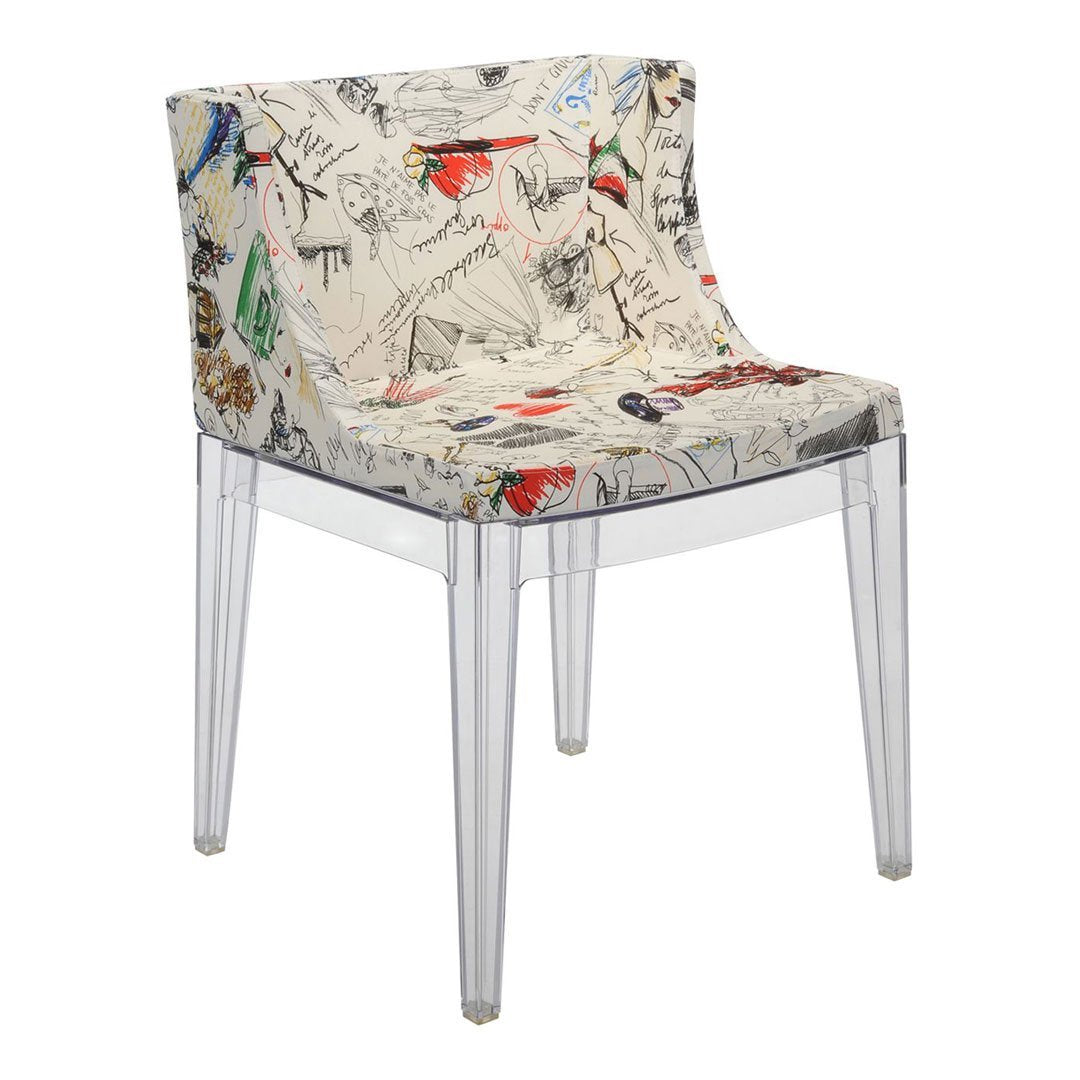 Clear acrylic chair with colorful, hand-drawn floral and bird patterns on a light background.