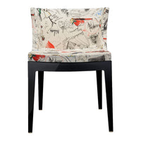 Cream fabric chair with abstract multicolor patterns and black wooden legs. Stylish and modern design for any space.