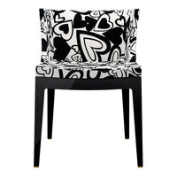 Black and white chair featuring a playful heart pattern, ideal for adding a touch of whimsy to any space.