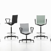 Colorful modern chairs in black, grey, and mint green with sleek patterns, perfect for contemporary spaces.