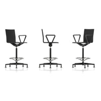 Modern black swivel stool with minimalist design and sleek chrome base, showcasing a contemporary and stylish aesthetic.