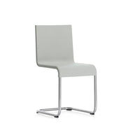 Modern gray chair with a sleek design and a smooth, solid pattern, featuring a chrome base for a contemporary look.