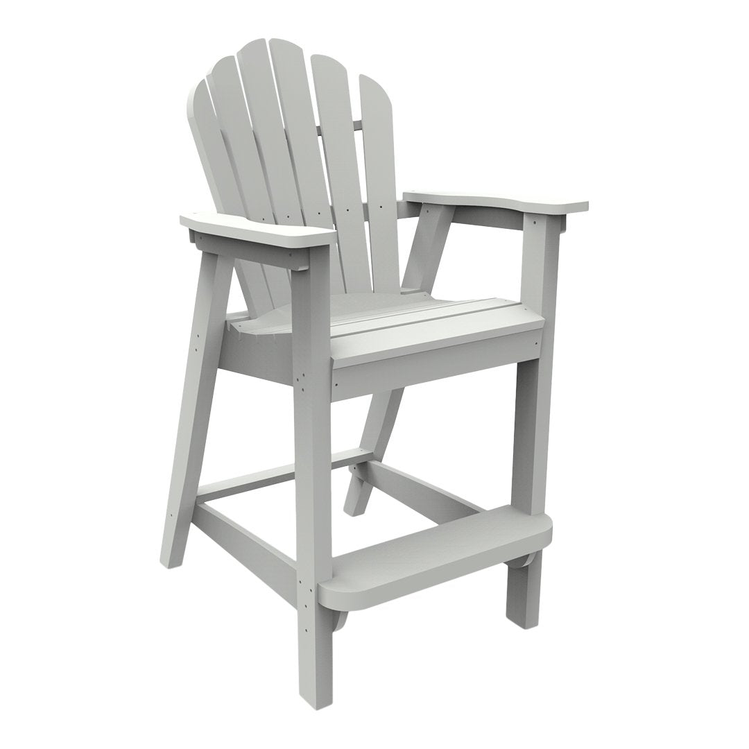 Gray Adirondack chair with a slatted backrest and armrests, perfect for outdoor seating. Classic coastal design.