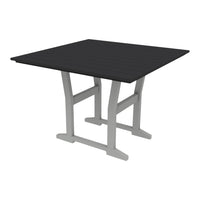 Square outdoor table featuring a sleek black top and modern gray legs. Ideal for contemporary settings.
