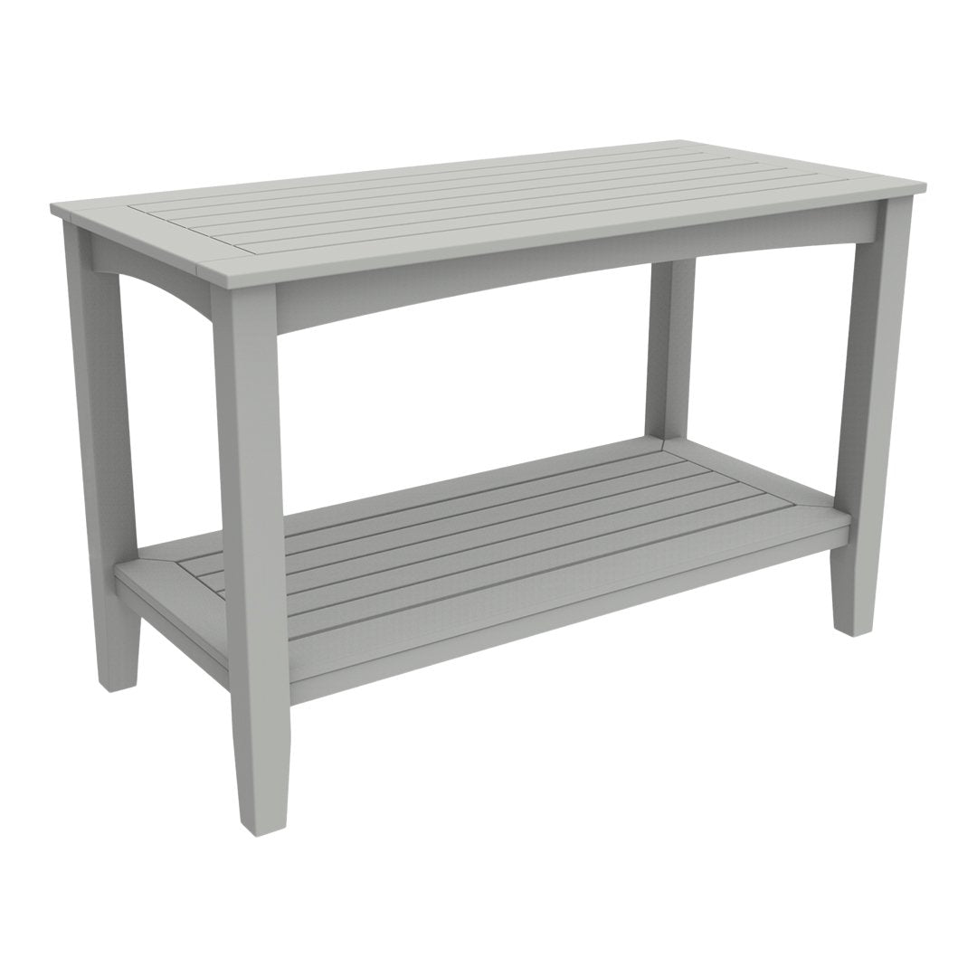 Gray slat-top outdoor table with a clean, modern design and sturdy legs, featuring a lower shelf for added storage.