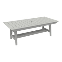 Gray rectangular outdoor table with slatted surface design and central umbrella hole. Perfect for patio setups.