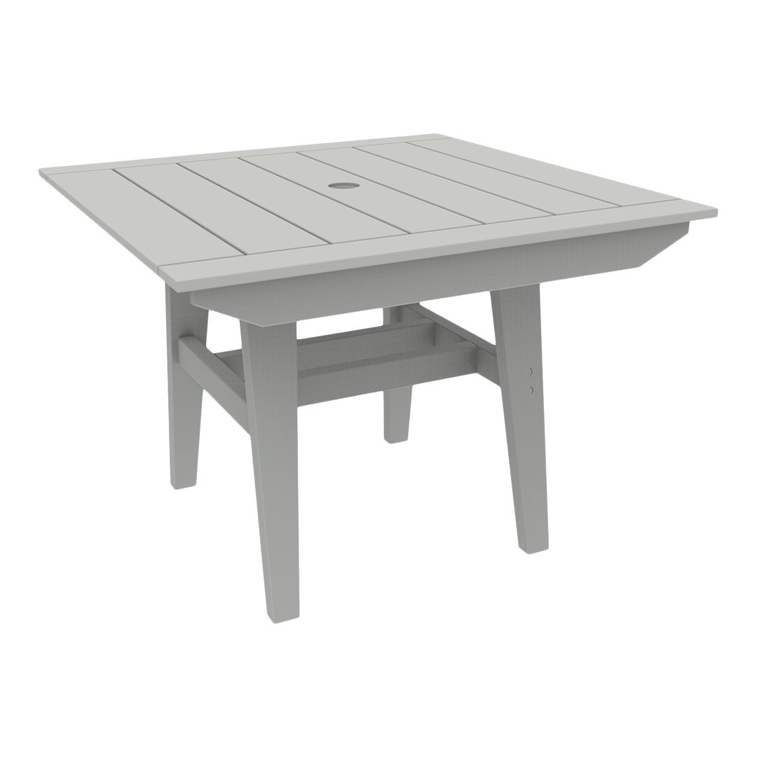 Gray square outdoor table with a slatted surface and a central hole for an umbrella.