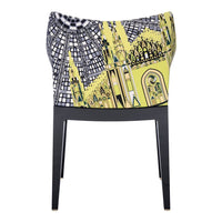 Stylish chair with bold yellow and black geometric patterns, featuring intricate architectural designs.