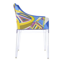 Colorful abstract patterns in blue, yellow, and purple on a modern chair with transparent legs.