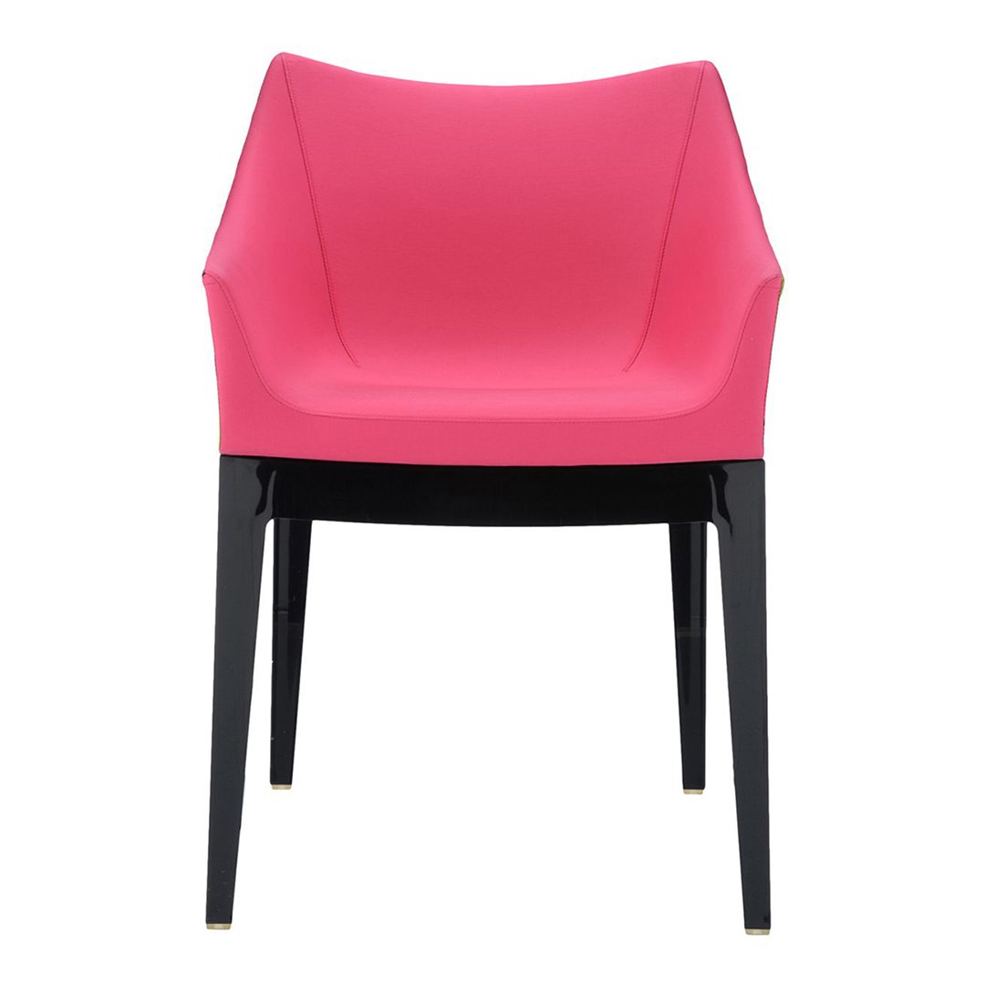 Pink modern chair with sleek, black legs and minimalistic design. Ideal for contemporary decor and vibrant spaces.