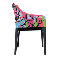 Colorful chair with pink, green, and blue patterns featuring intricate swirls on a black leg frame.