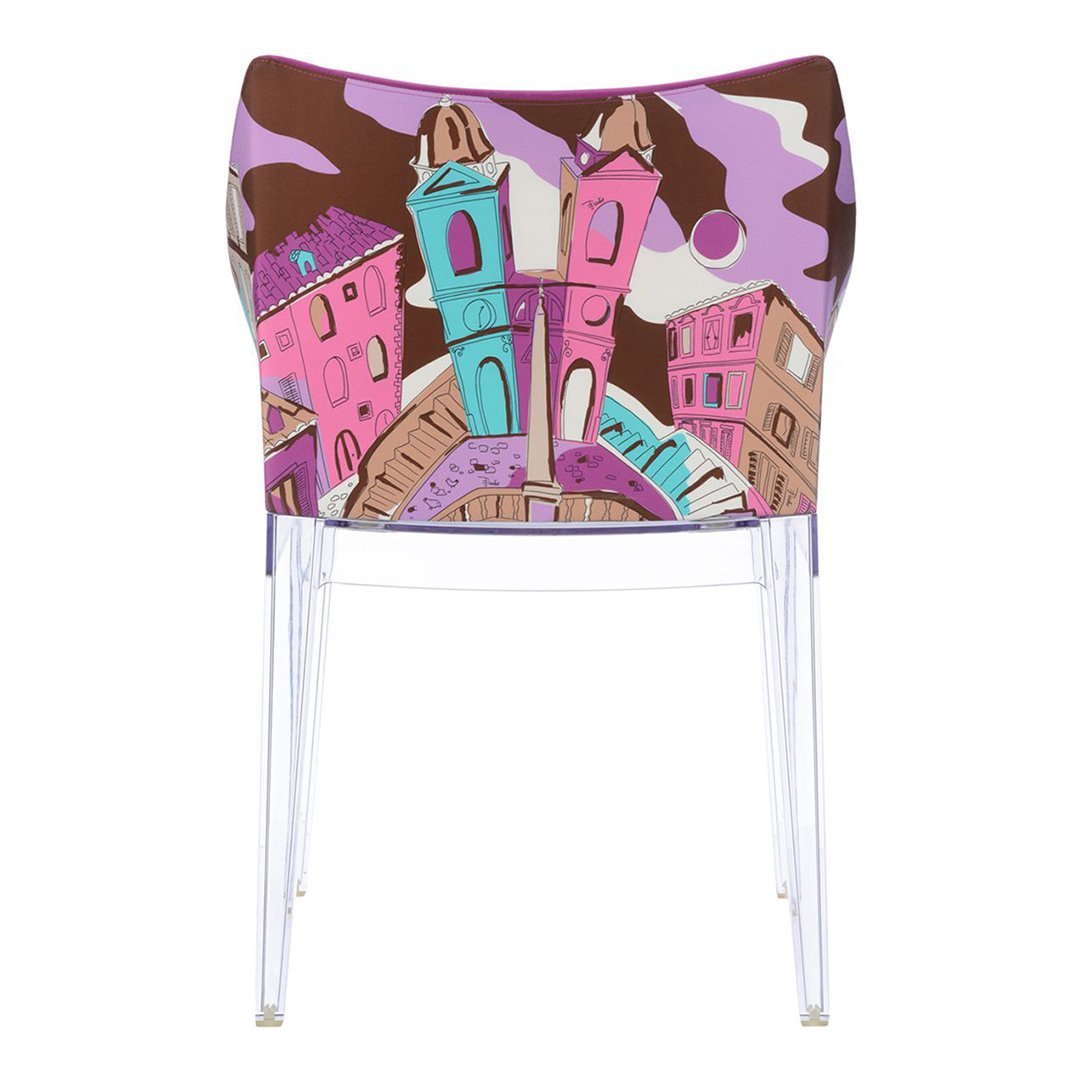Colorful chair back featuring pink, turquoise, and brown abstract cityscape design with playful patterns.
