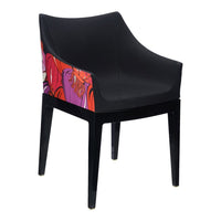 Black chair featuring vibrant floral patterns in shades of pink, orange, and purple on the backrest.