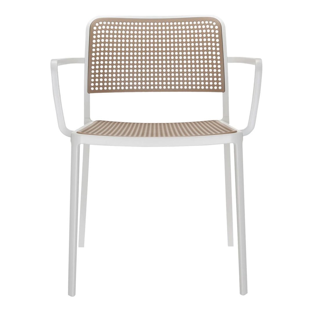 Modern white armchair with a patterned brown mesh back and seat, perfect for stylish indoor or outdoor settings.