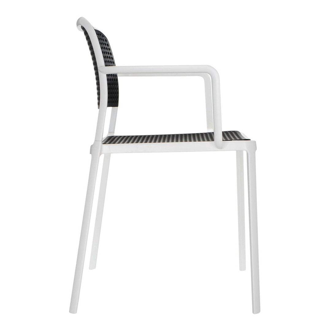 Modern white chair with a black woven seat and backrest, featuring a sleek, minimalist design.
