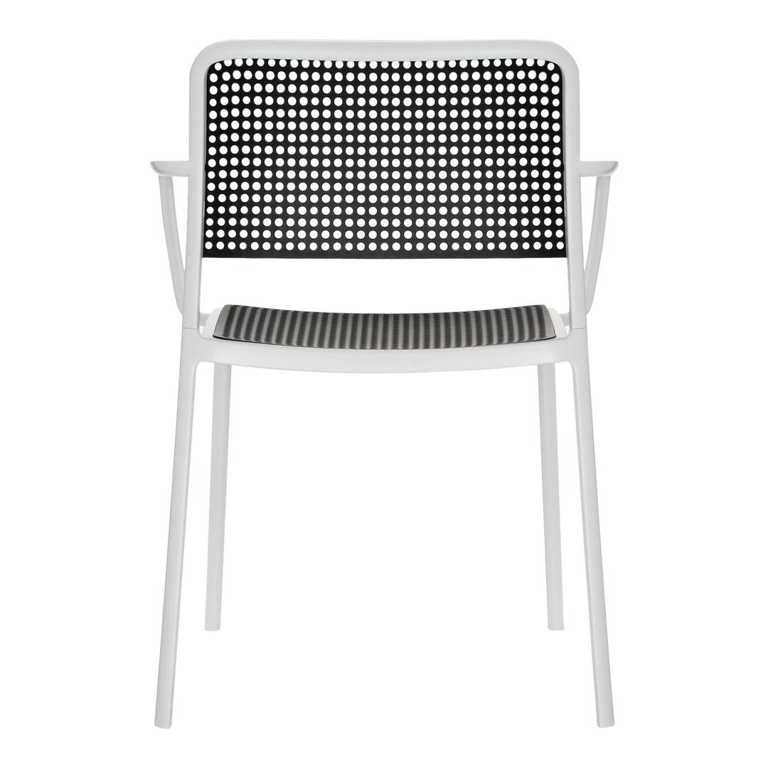 White chair with a black patterned backrest and seat, featuring a grid design for modern decor.