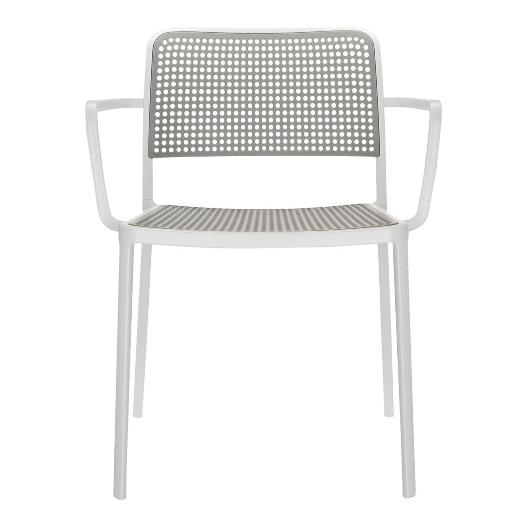 Gray perforated chair with a minimalist design and matching armrests, featuring a sleek white frame.