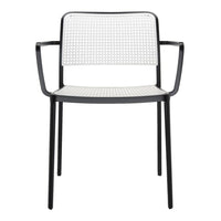 Black and white perforated chair with a sleek design and modern aesthetic. Perfect for contemporary spaces.