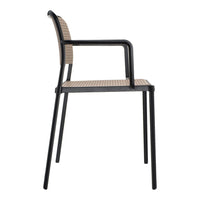 Side view of a modern chair featuring a black metal frame and a woven beige seat pattern.