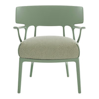 Green chair with textured light green fabric, featuring a modern design and subtle herringbone pattern.