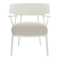 White chair with a chevron-patterned light gray cushion showcasing modern design and neutral tones.