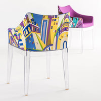 Colorful chair featuring vibrant geometric patterns in blue, yellow, and green, with a sleek purple back.