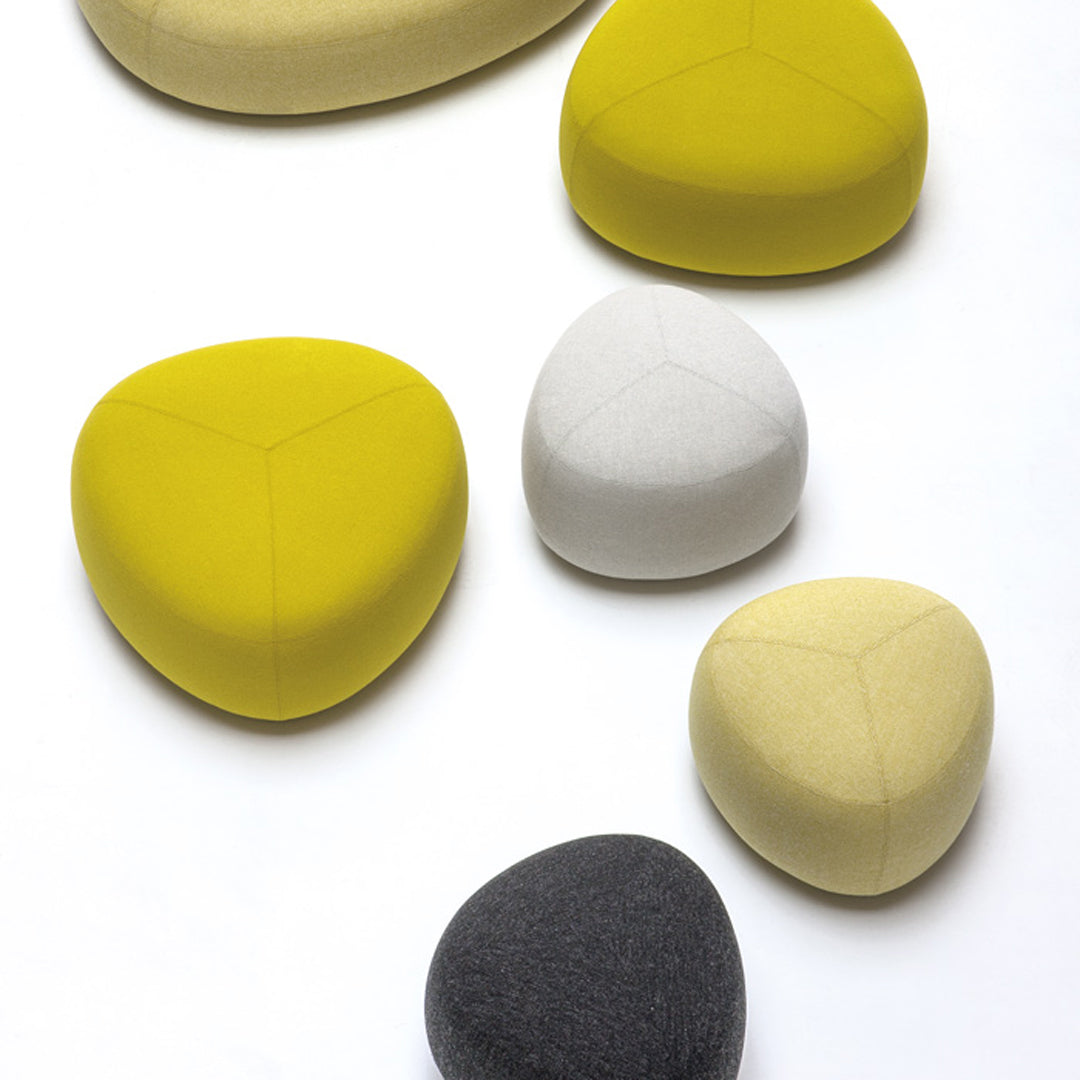 Colorful pebbles in shades of yellow, white, and gray with smooth patterns, ideal for decorative uses.
