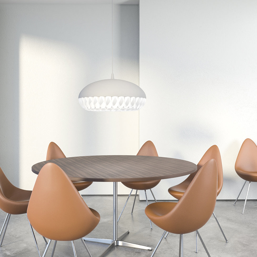 Brown dining chairs around a round wood table, complemented by a sleek white pendant light in a modern setting.