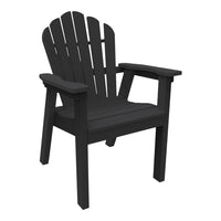 Black wooden Adirondack chair with classic slatted design and sturdy arms, perfect for outdoor relaxation.