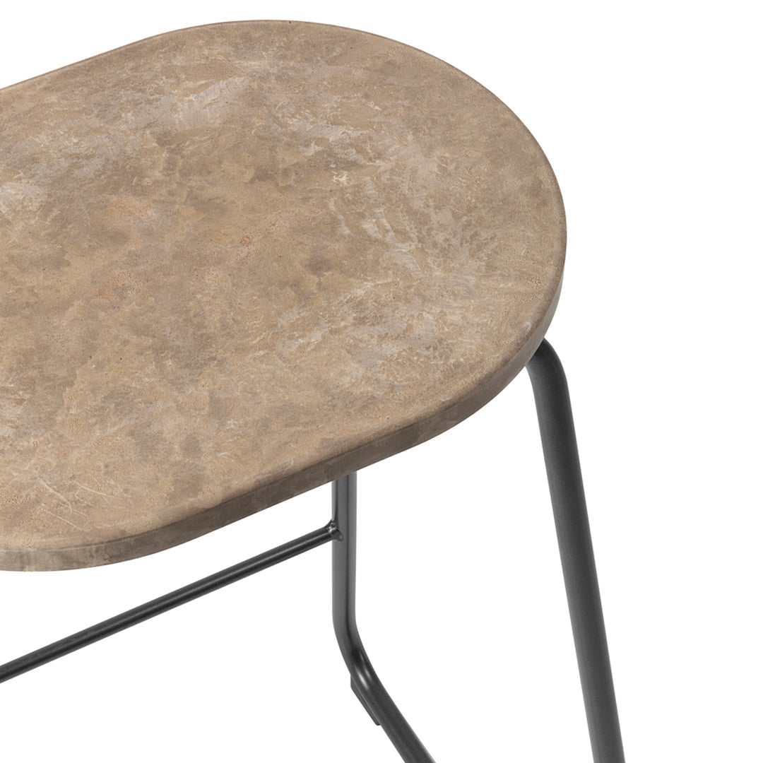 Rounded beige stone tabletop with natural texture, paired with a sleek black metal base. Perfect for modern decor.
