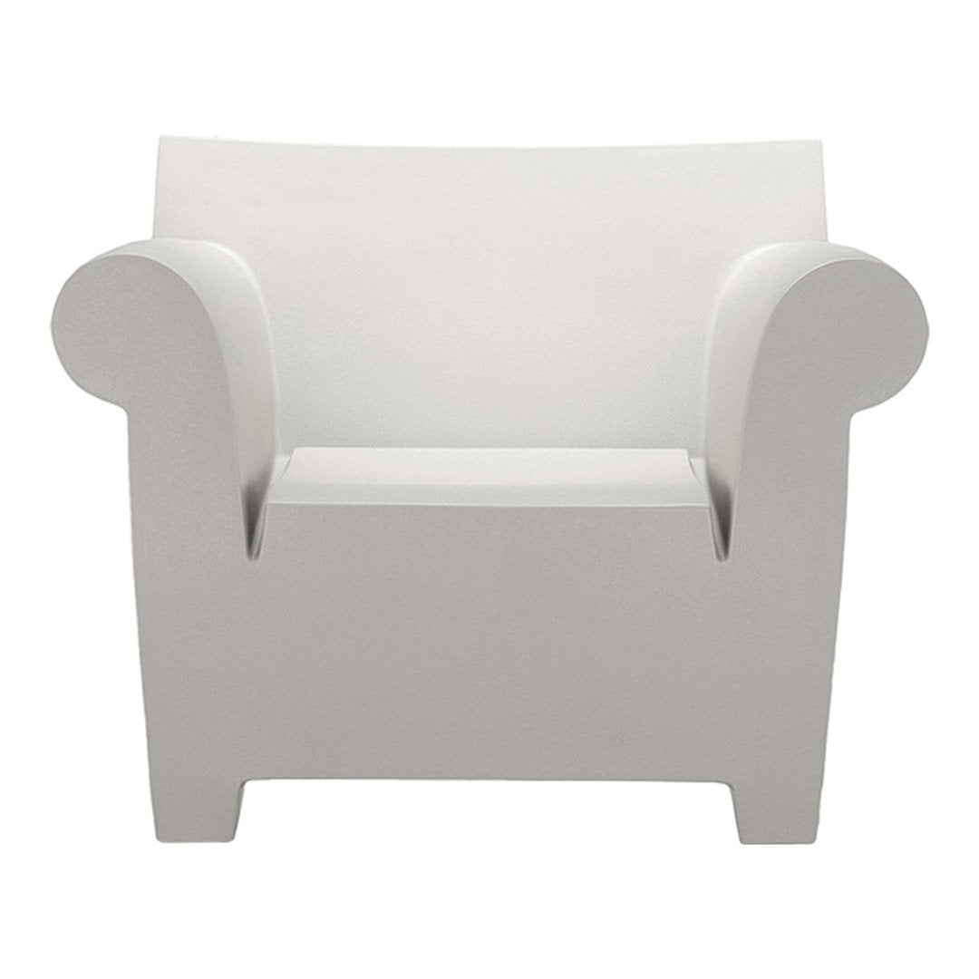 Modern white armchair with smooth, minimalist design and curved arms. Perfect for contemporary decor.