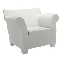 Sleek white armchair with a minimalist design and smooth, curved edges. Perfect for modern interiors.