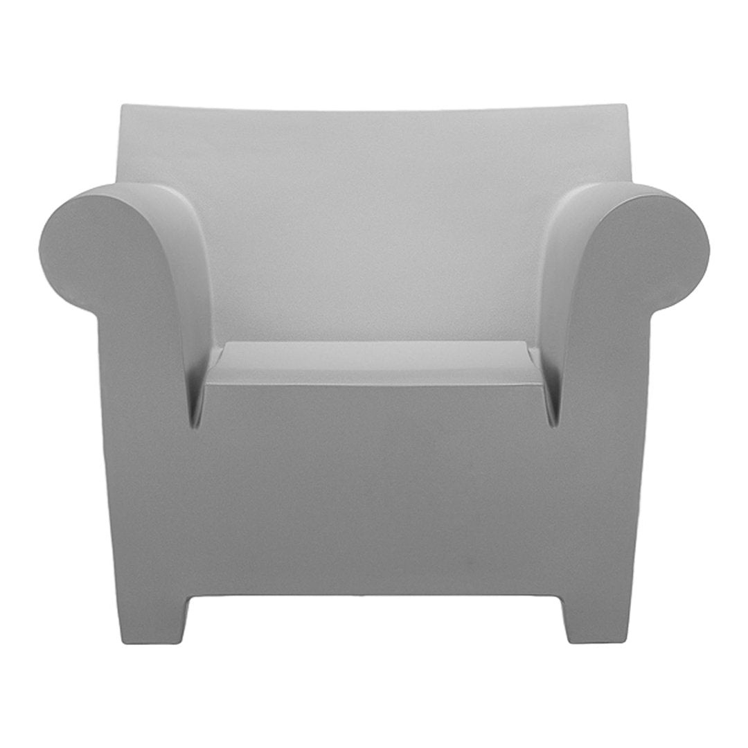 Stylish gray armchair with smooth, minimalist design and rounded arms, perfect for modern decor.