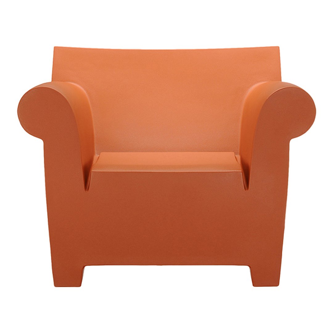 Orange modern armchair with smooth, rounded edges and a minimalist design. Perfect for contemporary decor.