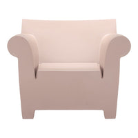 Light pink minimalist armchair with smooth, rounded edges and a contemporary design. Ideal for modern interiors.