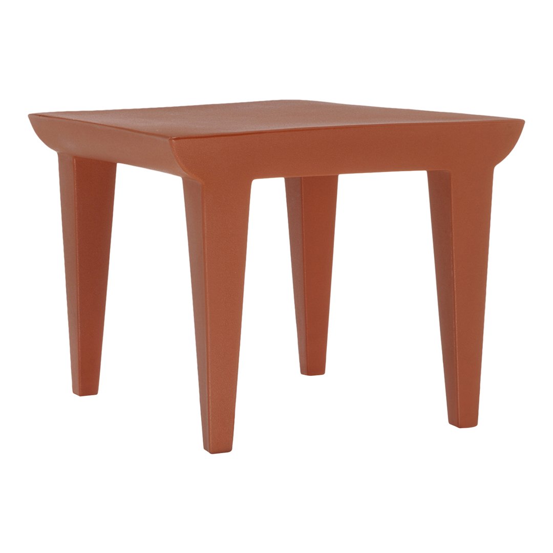 Square, terracotta side table featuring a smooth surface and tapered legs, perfect for modern decor.