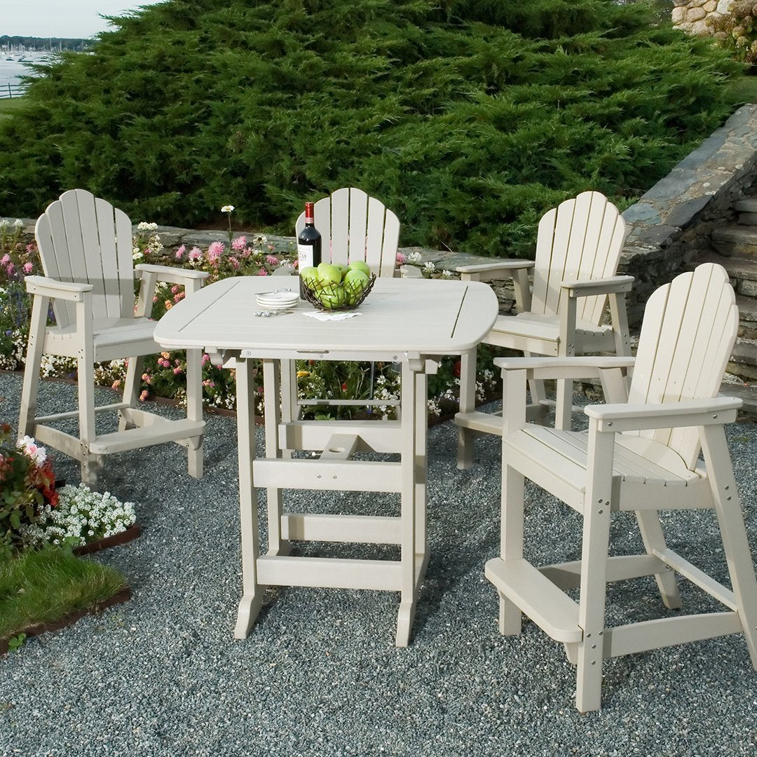 Light beige outdoor dining set with four high chairs and a round table, featuring slatted wood design and a natural setting.