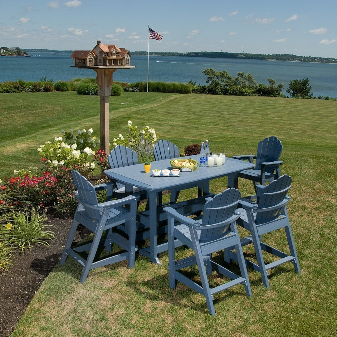 Blue outdoor dining set with matching chairs, set against lush green grass and a clear blue sky.