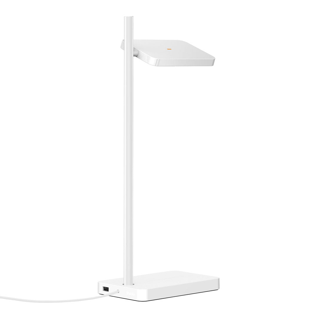 Sleek white desk lamp with a minimalist design, featuring a smooth finish and geometric lines for a modern look.