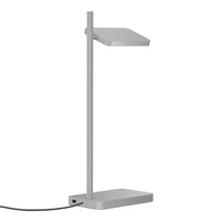 Slim silver desk lamp with a sleek geometric design and minimalistic style. Perfect for modern office spaces.