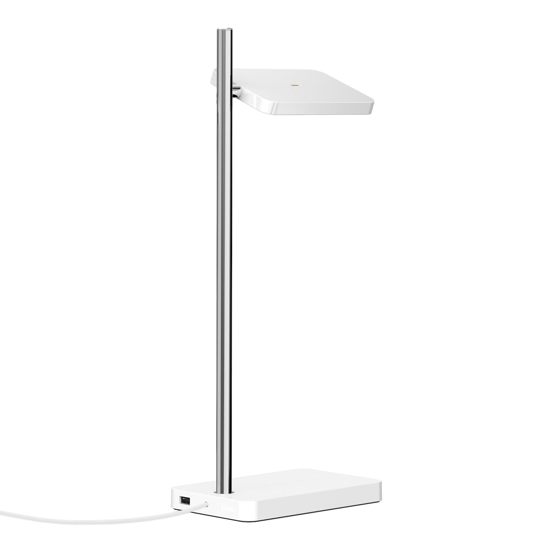 Modern white desk lamp with a sleek silver pole and minimalistic design. Perfect for any contemporary workspace.