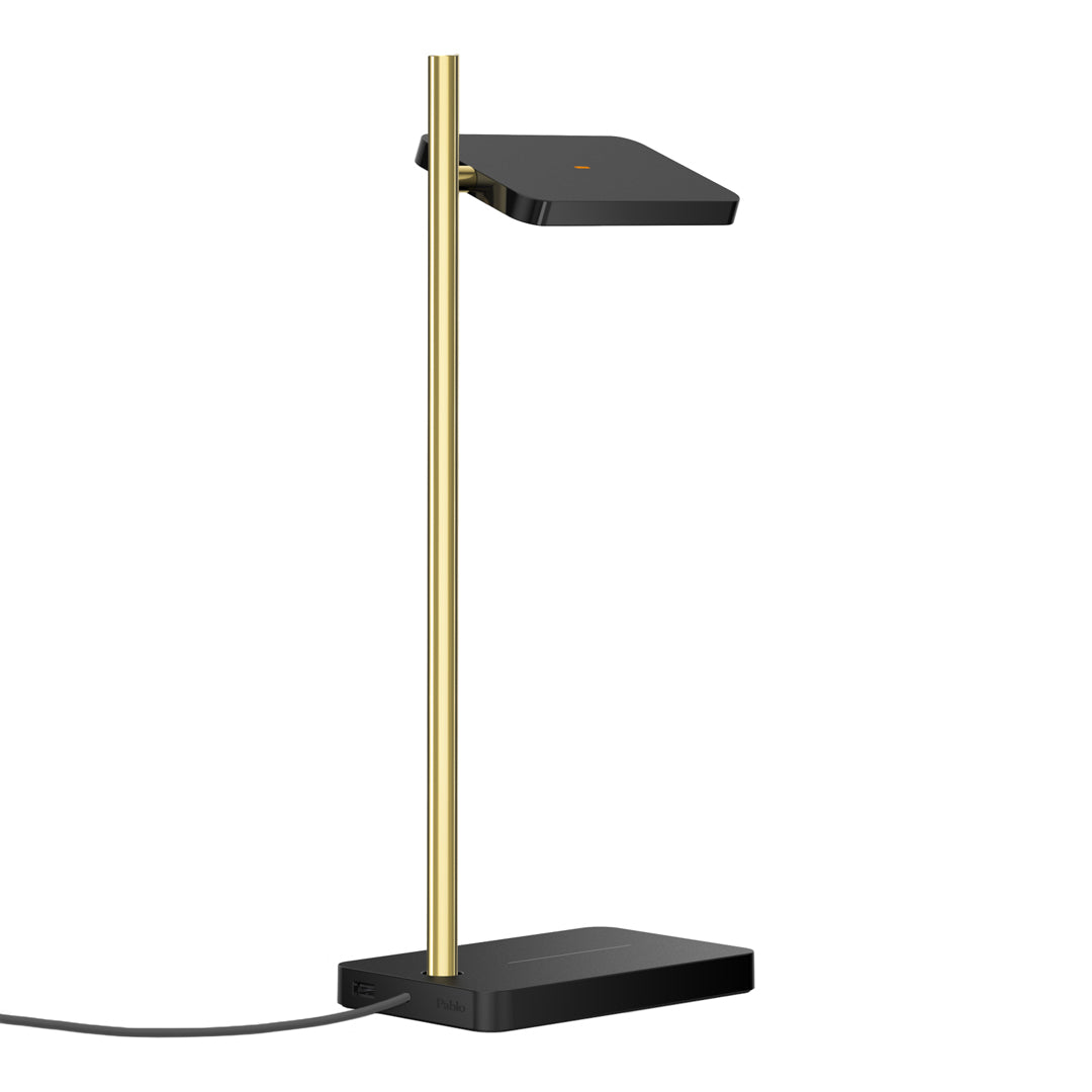 Sleek black and gold desk lamp with a modern, minimalist design and a rectangular shade. Perfect for stylish lighting.