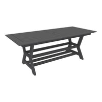 Gray outdoor dining table with a slatted top and sturdy X-frame design, perfect for stylish patio settings.
