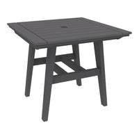 Square outdoor table in a sleek dark gray finish with a slatted top design and sturdy, minimalist legs.